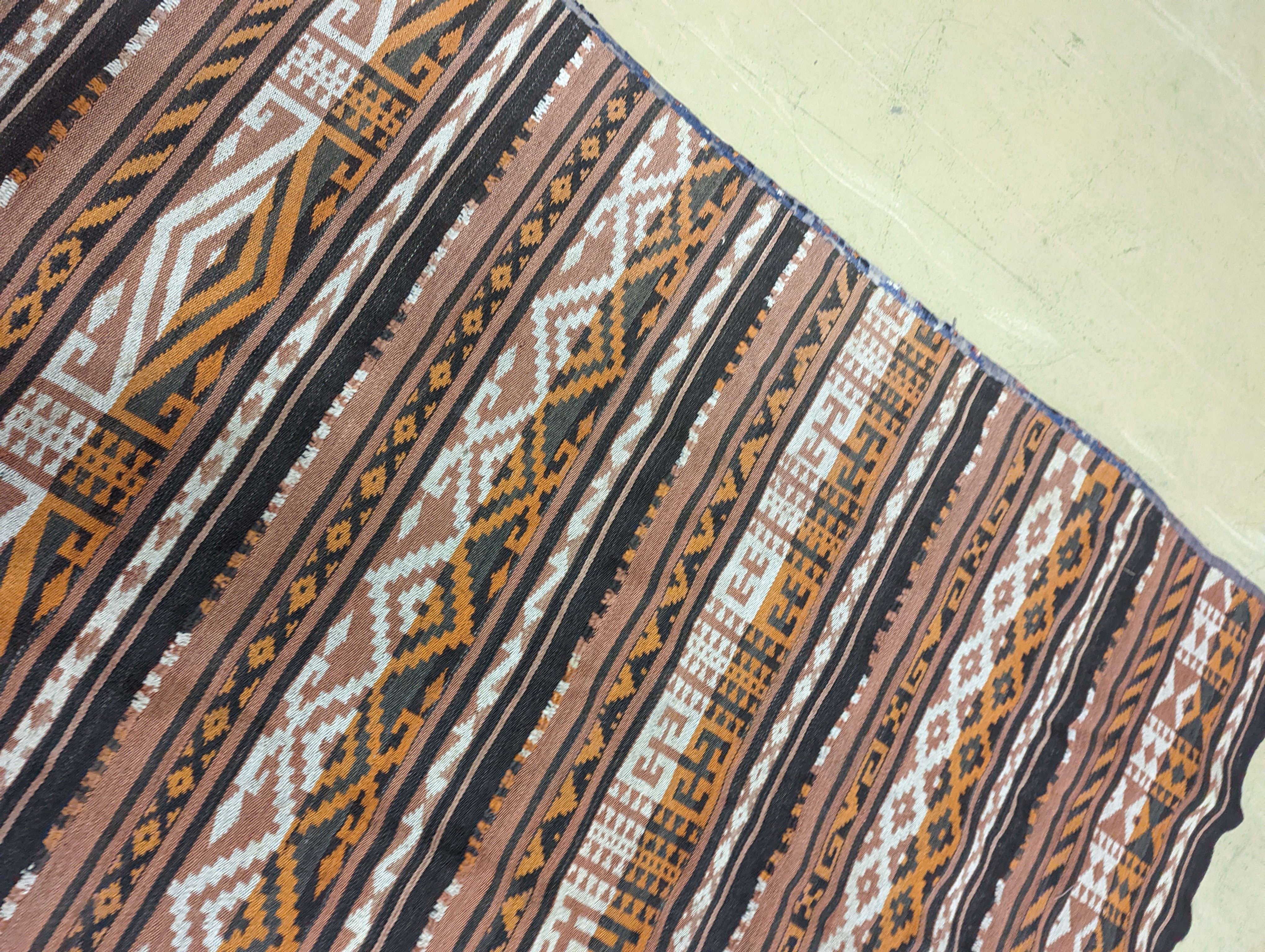 A polychrome flatweave carpet, approx. 330 x 180cm